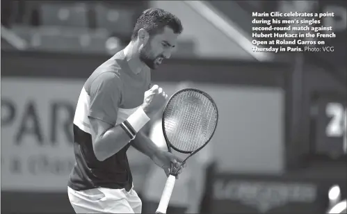  ?? Photo: VCG ?? Marin Cilic celebrates a point during his men’s singles second-round match against Hubert Hurkacz in the French Open at Roland Garros on Thursday in Paris.