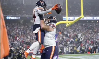  ?? Photograph: Steven Senne/AP ?? Chicago Bears running back Khalil Herbert (24) is hoisted by offensive tackle Teven Jenkins after his touchdown against the New England Patriots.