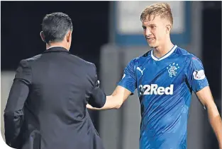  ??  ?? Pedro Caixinha congratula­tes Ross McCrorie after his debut against Partick Thistle