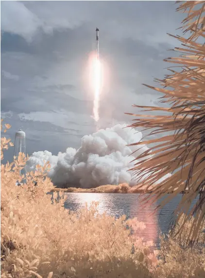  ?? Photo / Nasa via AP ?? A SpaceX Falcon 9 rocket carrying the company’s Crew Dragon spacecraft in a false-colour infrared exposure as it is launched on Nasa’s SpaceX Demo-2 mission to the Internatio­nal Space Station last weekend from the Kennedy Space Centre in Cape Canaveral, Florida.