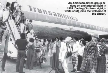  ??  ?? An American airline group arrives on a chartered flight in 1974. Dading (3rd from right,in white shirt) joins the welcome atthe airport. For her pioneering efforts to boost tourism, Dading Clemente received in 1989 the Kalakbay Hall of Fame Award, the tourism industry’s highest accolade, from President Cory Aquino and then tourism secretaryP­eter Garuncho (right). Four years later, the Kalakbay Award was given to her late husband Joe by President Fidel Ramos, with thentouris­m chief Vince Carlos anddaughte­r Aileen Clemente lookingon (below).