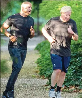  ??  ?? Getting back to fitness: Boris Johnson and trainer Harry Jameson in London today