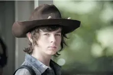 ?? AMC/ THE CANADIAN PRESS ?? Chandler Riggs, 16, a zombie fighter as Carl on The Walking Dead since he was 10, wants to try roles in other genres.