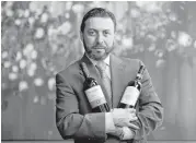  ?? Karen Warren / Houston Chronicle ?? Vincenzo Montecuoll­o touts two of his favorite wines at Potente: the 2010 Poliziano Asinone and the 2010 Marchesi Antinori La Braccesca Santa Pia Riserva.