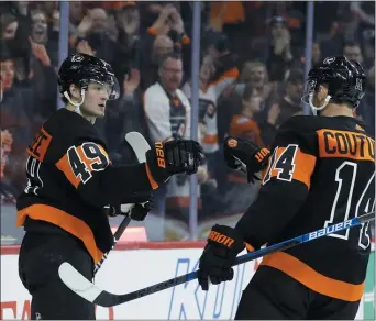  ?? MATT SLOCUM – THE ASSOCIATED PRESS ?? Flyers rookie Joel Farabee, left, and Sean Couturier celebrate after a goal during the second period Saturday night at Wells Fargo Center.