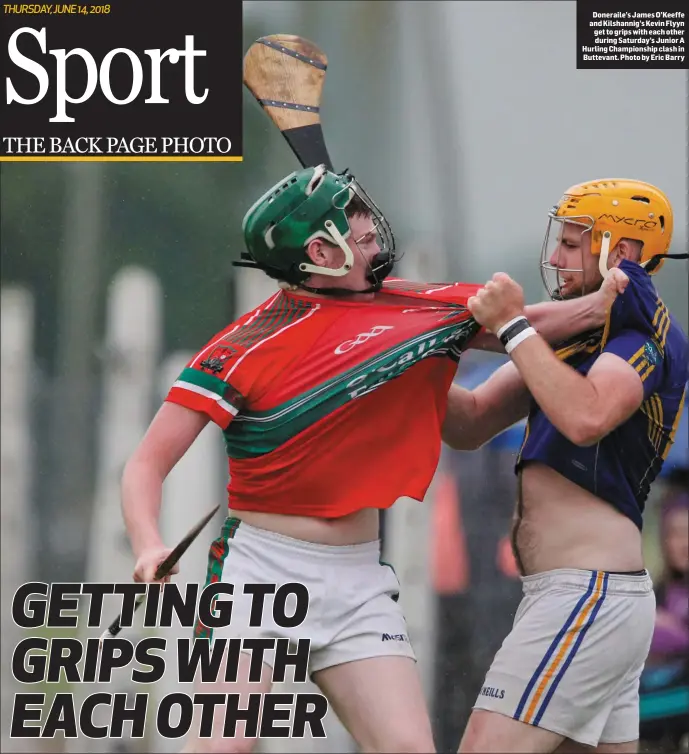  ?? Photo by Eric Barry ?? Doneraile’s James O’Keeffe and Kilshannig’s Kevin Flyyn get to grips with each other during Saturday’s Junior A Hurling Championsh­ip clash in Buttevant.