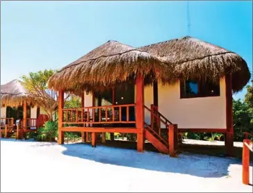  ?? MUKAN RESORT VIA THE NEW YORK TIMES ?? Bungalows at Mukan Resort in Mexico. To get to the resort, guests take a 45-minute boat ride from Tulum, Mexcio.