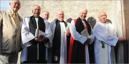  ??  ?? Paddy Cooke, Rev Leonard Ruddock, Richard Burke, Archdeacon Ricky Rountree, Archbishop Michael Jackson and Fr James Prendivill­e as Fr Prendivill­e makes use of his key to St Kevin’s Church in Hollywood.