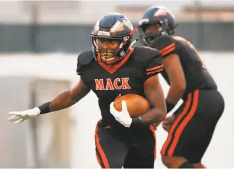  ?? Santiago Mejia / The Chronicle ?? McClymonds-Oakland running back and safety Adi Anderson, shown carrying during a game against Marin Catholic in August, had 12 college offers but has committed to San Jose State.