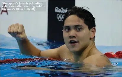 ??  ?? Singapore's Joseph Schooling celebrates after winning gold in the men's 100m butterfly