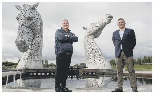  ??  ?? 0 Scottish Building Society’s Paul Denton and Ambiental’s Justin Butler announce partnershi­p at The Kelpies. Picture: Alistair Devine