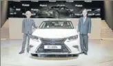  ??  ?? Lexus Internatio­nal president Yoshihiro Sawa (left) at the launch of the Lexus ES 300h on Friday.