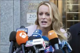  ?? MARY ALTAFFER — THE ASSOCIATED PRESS FILE ?? In this file photo, adult film actress Stormy Daniels speaks outside federal court, in New York. According to a person familiar with the matter, on Monday Daniels will meet with federal prosecutor­s in New York who are investigat­ing President Donald...