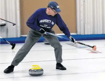  ?? ADAM MACINNIS/THE NEWS ?? Paul Doucet of Yarmouth Curling Club watches a rock during the semifinal round of the open division of the Harding Medical Provincial Stick Curling Championsh­ip held in New Glasgow Feb. 16 and 17. Doucet and his teammate Dave MacDougal went on to win the competitio­n.