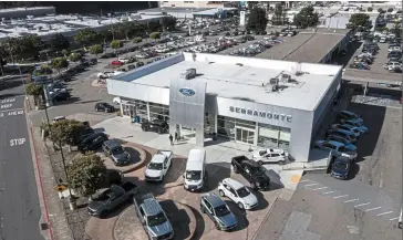  ?? — Bloomberg ?? Upward trajectory: A Ford dealership in Colma, California. As the American company turns its attention to electric vehicles and redesign activities, its profitabil­ity is on a path to improvemen­t.