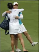  ?? WONG MAYE-E/ THE ASSOCIATED PRESS ?? South Korea’s Inbee Park, a Bishop Gorman High product, celebrates with an unidentifi­ed friend after winning the HSBC Women’s Champions tournament Sunday at Sentosa Golf Club in Singapore.