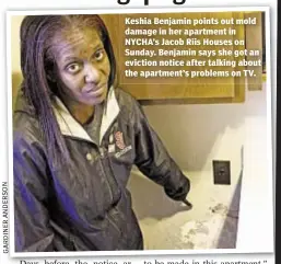  ??  ?? Keshia Benjamin points out mold damage in her apartment in NYCHA’s Jacob Riis Houses on Sunday. Benjamin says she got an eviction notice after talking about the apartment’s problems on TV.