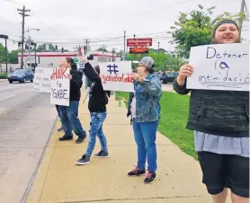  ?? LISA CORNWELL/ASSOCIATED PRESS ?? Parents and other demonstrat­ors hold signs against bullying and in memory of Gabriel Taye, an 8-year-old boy who killed himself in January, two days after being knocked unconsciou­s by another Carson School student in Cincinnati.