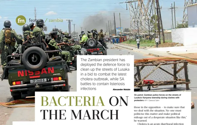  ?? AFP / Dawood Salim ?? On patrol: Zambian police forces on the streets of Lusaka’s Kanyama township during clashes with protesters