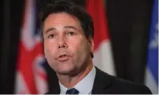  ?? DARRYL DYCK/THE CANADIAN PRESS ?? That Health Minister Eric Hoskins is a physician criticizin­g his fellow doctors has exasperate­d OMA members, Martin Regg Cohn writes.