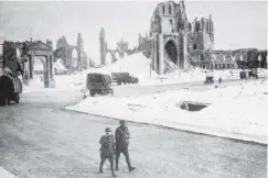  ?? COPIES OF PICTURE AVAILABLE FROM ODT FRONT OFFICE, LOWER STUART ST, OR WWW.OTAGOIMAGE­S.CO.NZ ?? A kindly mantle of snow softens the lines of the ruined cathedral of Ypres. — Otago Witness, 28.8.1918.