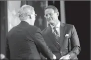  ?? AP Photo/Pablo Martinez Monsivais ?? Senate: Senate Majority Leader Mitch McConnell of Ky., left, is greeted by Family Research Council president Tony Perkins, right, before speaking to the 2018 Values Voters Summit in Washington, Friday.