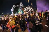  ?? PTI ?? Protesters march in downtown Columbus, Ohio