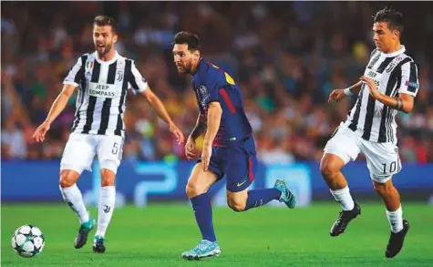  ?? Rex Features ?? Lionel Messi of Barcelona dribbles past Paulo Dybala of Juventus during a Champions League Group D clash in September. The two teams cross swords again today.