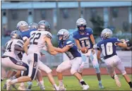  ?? Barbara Hall ?? Gordon Central quarterbac­k Peyton Wilson hands off to running back Brison Wilson during the first half of the Warriors’ home scrimmage against Coahulla Creek.