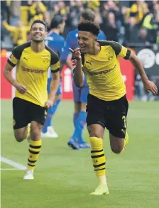  ??  ?? Jadon Sancho, right, joined Borussia Dortmund from Manchester City and is thriving in the Bundesliga Reuters
