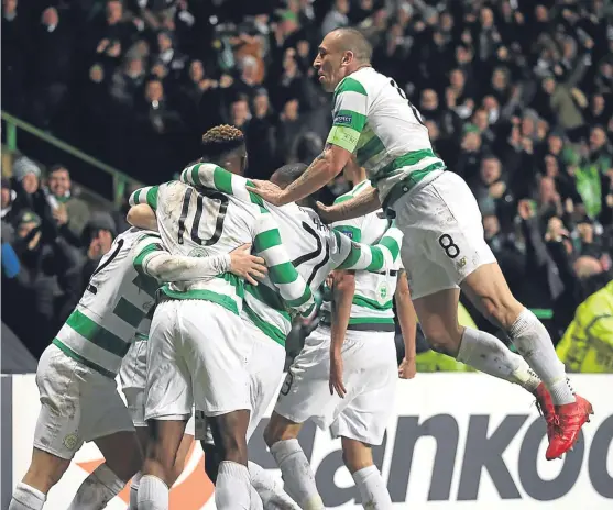  ?? Picture: PA. ?? Captain Scott Brown joins the celebratio­ns after McGregor opened the scoring for Celtic.