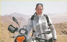  ?? COURTESY OF ALISA CLICKENGER VIA AP ?? Alisa Clickenger operates Women’s Motorcycle Tours, which conducts motorcycle rides that cater exclusivel­y to women, and estimates she’s traveled more than 250,000 miles on motorcycle­s. She’s shown here on a 2014 ride in Namibia.