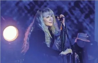  ?? VALERIE MACON/AFP VIA GETTY IMAGES ?? Stevie Nicks, seen here performing at Bonnaroo in 2022, is now a Barbie doll.