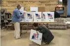  ?? Jordan Gale/The New York Times ?? Election workers begin to dismantle a polling place after closing on Election Day, Nov. 7, 2023, in Pella, Iowa.