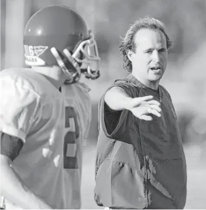  ?? Melissa Phillip / Houston Chronicle ?? Dana Holgorsen, right, gives guidance during his days as UH’s offensive coordinato­r under Kevin Sumlin. Holgorsen will take 9-2 West Virginia to a bowl for the fifth consecutiv­e year but is said to be open to leaving Morgantown.