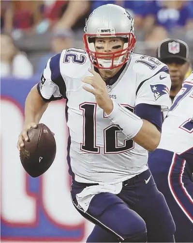  ?? AP PHOTO ?? MIRACLE WORKER: Pats quarterbac­k Tom Brady is so spry at 39, he’s even upped his running game.