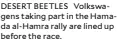  ?? ?? DESERT BEETLES Volkswagen­s taking part in the Hamada al-Hamra rally are lined up before the race.