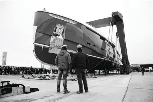  ??  ?? above: Workers look on as Utopia IV prepares for her launch last March.