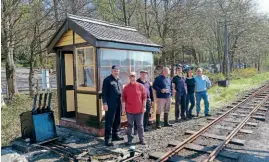  ??  ?? Llangower Group volunteers alongside the station's GWR-style signalbox which has been built by the Bala Lake Railway. BLR