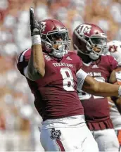  ?? Godofredo A. Vásquez / Staff photograph­er ?? Texas A&M DL DeMarvin Leal (8) provided a bright spot for the Aggies with an acrobatic intercepti­on.