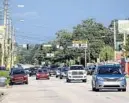  ?? JACOB LANGSTON/STAFF FILE PHOTO ?? Cars move along in the business section of Corrine Drive, where controvers­y about the busy roadway is most amplified.