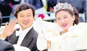  ?? AP ?? In this June 9, 1993, file photo, then Crown Prince Naruhito and Crown Princess Masako wave during their wedding parade in Tokyo. Japan is abuzz ahead of today’s ceremony marking Emperor Naruhito’s ascension to the Chrysanthe­mum Throne.