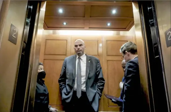  ?? Michael A. McCoy/The New York Times ?? U.S. Sen. John Fetterman, D-Pa., departs the Senate Floor following a vote on Capitol Hill on Feb. 15. After a brief hospital stay last month that followed an episode of lightheade­dness, Mr. Fetterman voluntaril­y admitted himself for psychiatri­c treatment, revealing to the world his depression diagnosis.