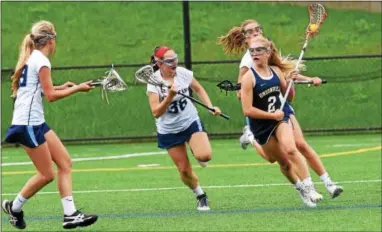  ?? ANNE NEBORAK — DIGITAL FIRST MEDIA ?? Claire Donovan of Unionville is watched by a trio of Villa Maria defenders Friday.