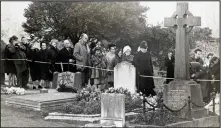  ??  ?? Last respects: Mourners visit Churchill’s grave at Bladon