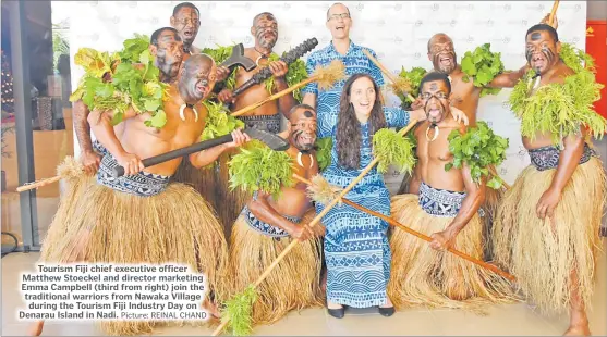 ?? Picture: REINAL CHAND ?? Tourism Fiji chief executive officer Matthew Stoeckel and director marketing Emma Campbell (third from right) join the traditiona­l warriors from Nawaka Village during the Tourism Fiji Industry Day on Denarau Island in Nadi.