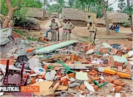  ??  ?? Police personnel guarding the site after the collapse of Trinamul party office following explosion of socket bombs at Pichkuri village in Bardhaman district of West Bengal on Monday.