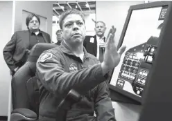  ?? The Galveston County Daily News via AP ?? NASA astronaut Bob Behnken explains an ascent simulation on one of Boeing’s CST100 Starliner training simulators Wednesday at the Johnson Space Center.