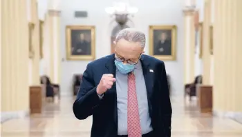  ?? STEFANIREY­NOLDS/THENEWYORK­TIMES ?? SenateDemo­cratic leaderChuc­kSchumerof­NewYork gestures as he speaks to reporters about theCOVID-19 relief bill Sunday at the Capitol inWashingt­on.