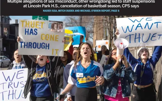  ?? ASHLEE REZIN GARCIA/SUN-TIMES ?? Ella Wong (center), a student at Lincoln Park High School, leads a march around the block after hundreds of students walked out of class Monday to protest the ouster of interim Principal John Thuet and Assistant Principal Michelle Brumfield and the cancellati­on of the boys basketball season.